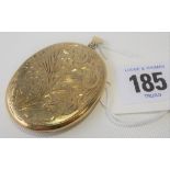 Modern silver gilt oval locket, foliate engraved, height 5cm.