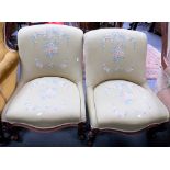 Pair of Victorian walnut upholstered nursing chairs with foliate carved cabriole forelegs &