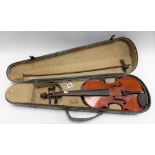 Stradivarius copy violin with 14in two piece back, bow and hard case.