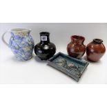 Five studio pottery wares including a St Ives pottery ovoid bottle Tenmoku glaze vase by Joanna