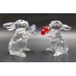 Two Swarovski crystal rabbits holding bunches of flowers, height 5.5cm.
