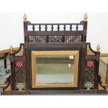 Victorian aesthetic period cast iron painted over mantel mirror, the frame cast with trellis over