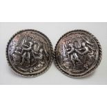 Good 19th Century continental silver cape clasp, each cast with an interior scene with lady &