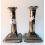 Pair of George V silver weighted candlesticks, Birmingham 1918, height 13cm.
