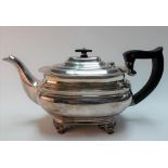 George V silver teapot by Goldsmiths & Silversmiths Company, of rectangular section raised on four