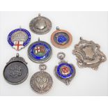 Five silver and enamel Football Association fob medals; together with three silver fob medals,