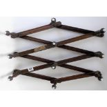 Victorian concertina action expanding wall hanging coat rack by Oetzmann & Co, Hampstead Row,