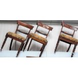 Set of four Victorian mahogany dining chairs with leaf terminal carved mid rails over an upholstered