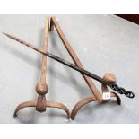 Pair of wrought iron andirons together with wrought iron poker