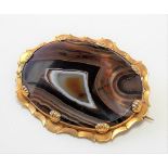 Victorian yellow metal mounted large oval agate slice brooch, width 52mm