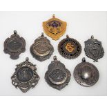 Six 1920's/30's cycling relating shield fob medals together with two base metal & enamel cycling