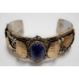20th Century Native American stirling silver bangle with oval blue stone cabochon inset signed A.