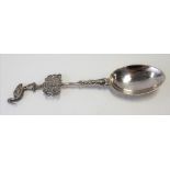 Dutch silver spoon, the handle cast with a wading bird over a pierced armorial, continental marks