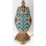 Rare Doulton silicon ware oil lamp in the form of an owl, the head forming the cover, the brass foot