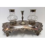 Victorian silver plate ink stand with two cut glass bottles and a central candlestick, the base