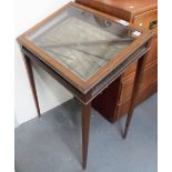 Edwardian inlaid slope front bijouterie table, the sloped inlaid hinged front over glazed sides &