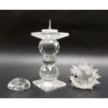 Four items of Swarovski crystal comprising a candlestick, hedgehog and small peacock, height of