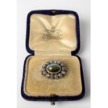 Attractive Edwardian Chrysoberyl cats eye & diamond cluster oval brooch by Garrard & Co Ltd, with