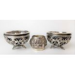 Pair of Indian silver circular salts with wirework and coin sides, coconut shell liner and silver