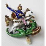 A 16th Century style gilded white metal & coloured enamel pendant cast as St George on horseback