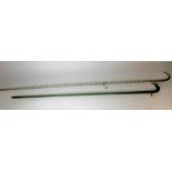 Two glass twist walking canes, one clear, the other green, length of clear cane 120cm.