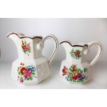 Pair of 19th Century graduated Swansea Pottery octagonal section jugs with serpent handles, the