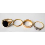 Four gold rings inc. a 22ct wedding band, an 18ct & platinum set diamond three stone ring, a 14ct