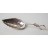 George III silver caddy spoon naturalistically styled as a leaf & with bright cut engraving,