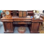 Good early Victorian flame mahogany credenza, the raised back with leaf scroll supports, the break