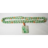 Good Chinese white and green flecked two strand pendant necklace, the rectangular carved and pierced