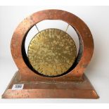 Newlyn copper Arts and Crafts dinner gong, the brass gong in a copper circular aperture, stamped '