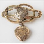 Victorian gold tubular and foliate engraved brooch with heart-shaped pear locket drop, weight 6.2g