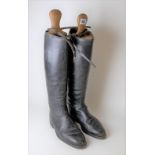 Pair of black leather hunting boots with boot lasts, size 5