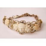 Unusual Victorian gold, bone and turquoise set bracelet, the front carved with the head of a woman