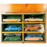 Six various Dinky Toys diecast cars, including a Studebaker no. 172, Cadillac Eldorado no. 131.