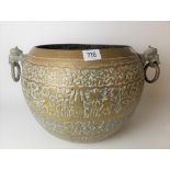 Indian brass embossed ovoid twin ring handled bowl, the handles cast as stylised elephants with rope