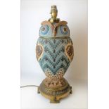 Rare Doulton Silicon ware oil lamp in the form of an owl, the head forming the cover, the brass foot