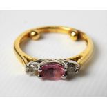 Gold and platinum diamond and pink sapphire set three stone ring, the two diamonds of 0.05ct