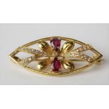 Attractive modern 18ct hallmarked gold ruby and diamond set brooch, the two rubies of pear-shaped