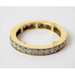 Yellow metal diamond set full eternity ring, each stone of 0.04ct spread approx, weight 2.8g
