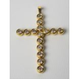 18ct gold diamond collet set cross pendant, with fifteen diamonds of 0.07ct spread approx, height