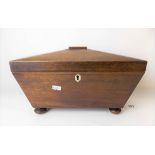 19th Century mahogany tea caddy of sarcophagus form, the hinge-lid revealing three compartments with