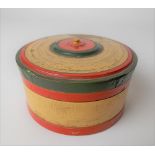 Turned wood painted circular box containing six cylindrical stacking nests of boxes, diameter 8cm