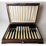 George VI silver ivory handled cased set for six fish knives and forks, maker JS & S.
