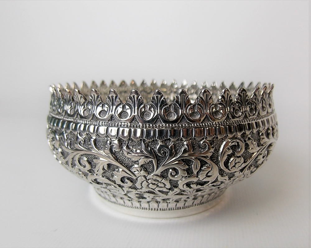 19th Century Indian silver small foliate scroll embossed bowl, the interior stamped D.H BHUJ,
