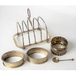 Modern silver four section toast rack, Sheffield 1970; together with three silver napkin rings and a
