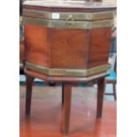 George III brass bound mahogany octagonal cellaret, the hinged lid with drop handle, with twin