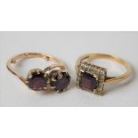 9ct garnet & diamond cluster ring; together with a yellow metal two stone cross-over ring, weight