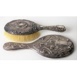 Victorian silver Art Nouveau hand mirror embossed with stylised poppy heads and scrolling leaves,