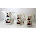 Graduated set of three gaudy Welsh pottery graduated octagonal jugs, the largest height 18.5cm, with